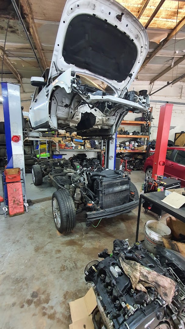 Engine and subframe out on the lift at The Top Garage