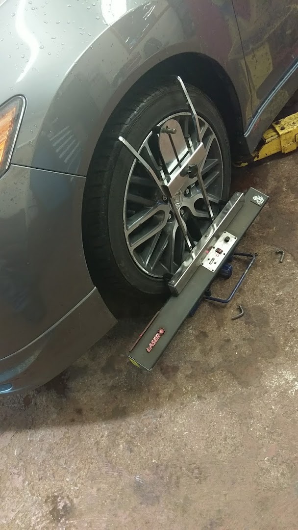 Laser wheel alignment rig in use
